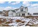 Charming two-story home with white siding, covered porch, and spacious front yard at 7161 Jackson Dr, Cumberland, IN 46229