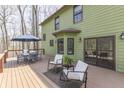Spacious deck is perfect for outdoor dining and relaxing with serene views of the surrounding nature at 1032 E Woodall Ct, Martinsville, IN 46151