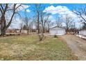 Spacious backyard featuring a large, well-maintained lawn and detached two-car garage at 1901 E Edgewood Ave, Indianapolis, IN 46227