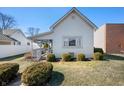 Charming exterior of a home with a covered front porch and manicured shrubbery at 234 S East St, Pendleton, IN 46064