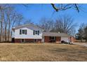 Charming two-story home featuring brick and siding accents, an attached garage, and a well-maintained front yard at 24535 Jerkwater Rd, Sheridan, IN 46069