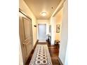An inviting entryway featuring a decorative rug and minimalist decor elements at 430 N Park Ave # 302, Indianapolis, IN 46202