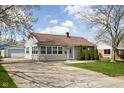 Inviting single Gathering home with a well maintained lawn and a driveway with extra parking at 506 Carol Dr, Greenwood, IN 46143