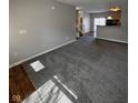 Spacious living room with gray walls and plush carpeting, perfect for relaxing or entertaining at 5142 Tuscany Ln, Indianapolis, IN 46254