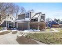 Charming townhouse exterior with a two-car garage, beautiful siding, and a paved driveway at 7779 Harbour # 51, Indianapolis, IN 46240