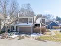 Charming townhouse exterior with a two-car garage, beautiful siding, and a paved driveway at 7779 Harbour # 51, Indianapolis, IN 46240