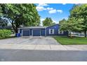 Detached two-car garage with navy blue siding and white trim offering ample parking and storage at 790 N 14Th St, Noblesville, IN 46060
