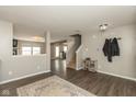 Open-concept living room with hardwood floors, leading to staircase, and offering ample space for entertaining guests at 8394 S Shady Trail Dr, Pendleton, IN 46064