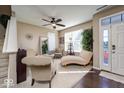 Comfortable seating area bathed in natural light through large windows, creating a bright and inviting space at 8416 Whitaker Valley Blvd, Indianapolis, IN 46237