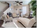 Cozy living room featuring neutral tones, plush seating, a decorative mirror, and ample natural light at 8416 Whitaker Valley Blvd, Indianapolis, IN 46237