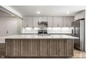 Beautiful kitchen showcasing custom cabinets, marble countertops, and a spacious center island with ample seating at 8888 Cholla Rd, Indianapolis, IN 46240