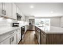 Stylish kitchen featuring stainless steel appliances, custom cabinets, and elegant backsplash, perfect for cooking at 8888 Cholla Rd, Indianapolis, IN 46240