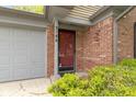 Close-up of the front door and brick facade, highlighting the entrance and attached garage at 9788 Pine Ridge North Dr, Fishers, IN 46038