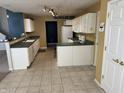 Functional kitchen features ample counter space, white cabinets, and essential appliances for your culinary needs at 1148 Nanwich Ct, Indianapolis, IN 46217