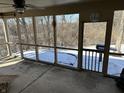 Enjoy outdoor living on this screened porch, offering views of the backyard and providing a relaxing space at 1148 Nanwich Ct, Indianapolis, IN 46217