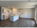 Spacious kitchen with a center island, white cabinets, and plenty of room for dining at 1414 Bluebonnet Pl, Shelbyville, IN 46176