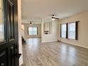 Bright, spacious living room with vinyl floors, recessed lights, and abundant natural light at 1427 Broyles Ln, Indianapolis, IN 46231