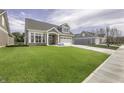 Beautifully landscaped lawn and stone-accented home with a two-car garage at 16822 Imperial Ct, Fishers, IN 46040