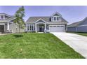 Charming two-story home featuring a well-manicured lawn, stone accents and attached two-car garage at 16822 Imperial Ct, Fishers, IN 46040