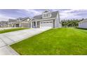 Well-maintained home with a manicured lawn and a spacious driveway at 16822 Imperial Ct, Fishers, IN 46040