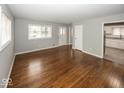 Open living space with hardwood floors offering views of the kitchen area at 226 N 8Th Ave, Beech Grove, IN 46107