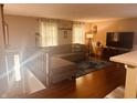 Sunlit living room boasting hardwood floors and comfortable, oversized seating at 2317 Lincoln Dr, Cicero, IN 46034
