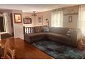 Cozy living room features hardwood floors and a comfortable sectional sofa at 2317 Lincoln Dr, Cicero, IN 46034
