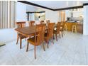 Inviting dining room with hardwood table and chairs, open to the kitchen at 2613 E 7Th St, Anderson, IN 46012