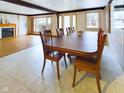 Inviting dining room with hardwood table and chairs, open to the living room at 2613 E 7Th St, Anderson, IN 46012