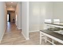 Bright dining area with bench seating, a view of the hall, and stylish flooring at 2976 W Tapestry Dr, Monrovia, IN 46157