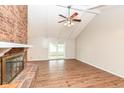 Spacious living room with a brick fireplace and sliding glass doors to the patio at 406 Hickory Dr, Greenfield, IN 46140
