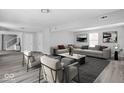 Open living room with modern furniture, decor and a large window at 6205 Beech Grove Rd, Martinsville, IN 46151