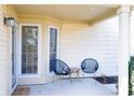 Inviting front porch featuring stylish seating, a neutral color scheme and a welcoming ambiance at 6348 Bay Vista E Dr, Indianapolis, IN 46250