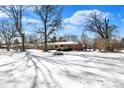 Spacious backyard with mature trees, providing a serene and private outdoor space at 6838 Hague Rd, Indianapolis, IN 46256