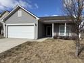 Inviting single-story home with a well-maintained lawn and attached garage at 8412 Pippen Pl, Camby, IN 46113