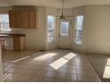 Kitchen and breakfast nook featuring tile flooring and access to the backyard at 9107 Tenor Way, Indianapolis, IN 46231