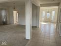 Spacious living room with a combination of tile and carpet flooring at 9107 Tenor Way, Indianapolis, IN 46231