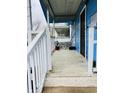 View of the front porch with tiled floor and white railing at 945 N Ewing St, Indianapolis, IN 46201
