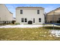 Spacious fenced backyard with a patio area, grill, and room for outdoor activities at 9698 W Lantern Ln, Pendleton, IN 46064