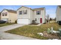 Charming two-story home featuring tidy front lawn, attached garage, and well-kept landscaping at 9698 W Lantern Ln, Pendleton, IN 46064