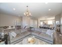Spacious living room with a comfortable sectional sofa, stylish decor, and hardwood floors at 1208 Chapman Dr, Westfield, IN 46074