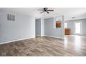 Open-concept living room with new flooring and neutral wall color at 13332 N Brick Chapel Dr, Camby, IN 46113