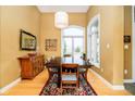Traditional dining room featuring hardwood floors and a large sunny window at 14020 Quarter Horse Ct, Carmel, IN 46032