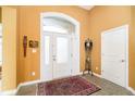 Warm foyer with tile flooring, a patterned rug, and lots of natural light at 14020 Quarter Horse Ct, Carmel, IN 46032