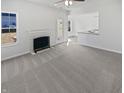 A spacious living room is freshly painted with neutral carpet and natural light at 1535 Arbor Springs Dr, Brownsburg, IN 46112