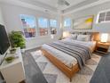 Bright main bedroom featuring a large bed, plush rug, and multiple windows at 1670 Rossmay Dr, Westfield, IN 46074