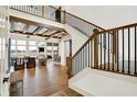 Spacious living room with high ceilings, wooden beams, and large windows offering ample natural light at 19795 Chatham Shore Ln, Westfield, IN 46074