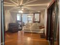 Inviting living room with hardwood floors, a ceiling fan, and neutral-colored furniture at 2122 George St, Anderson, IN 46016