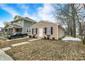 Cozy house with a clean exterior and a small front yard with minimal landscaping at 2402 Adams St, Indianapolis, IN 46218