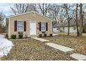 View of the house with a walkway leading to the front door at 2402 Adams St, Indianapolis, IN 46218